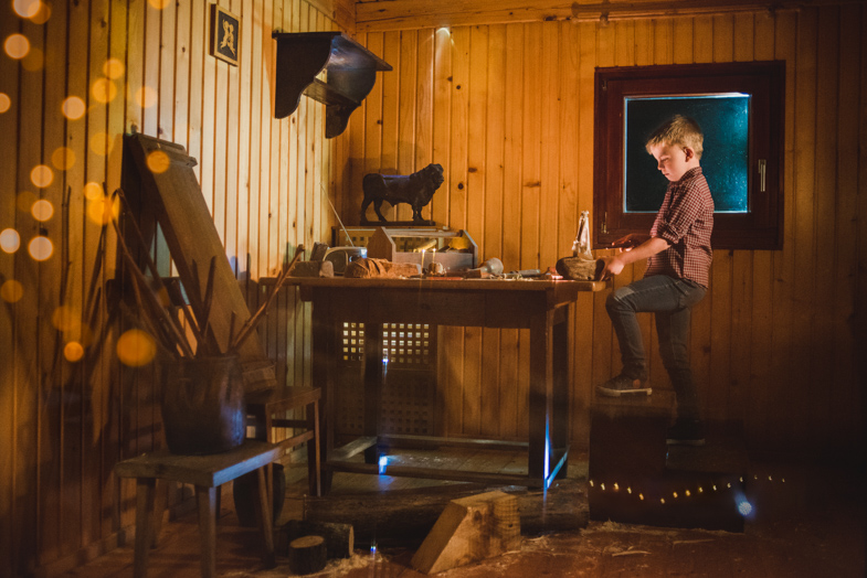 A professional creative portrait of a child depicted as a carver.