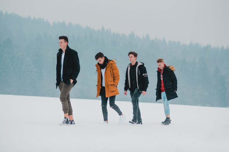 Promotional painting of a music band in the snow.